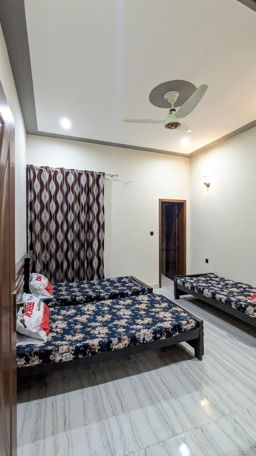 Hostels in Lahore for female — tiled en-suite bathroom
